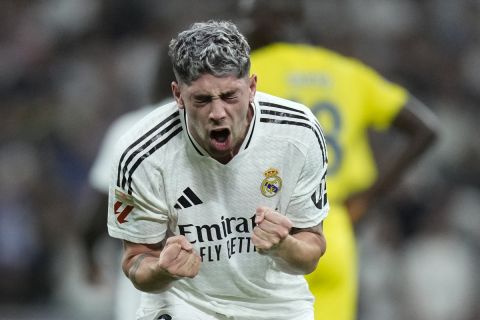 Real Madrid's Federico Valverde celebrates after he scored during the La Liga soccer match between Real Madrid and Villareal in Madrid, Spain, on Saturday, Oct. 5, 2024. (AP Photo/Bernat Armangue)