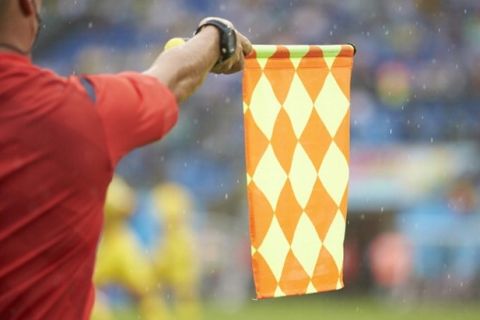 Soccer: FIFA World Cup: Closeup of linesman holding flag during Mexico vs Cameroon Group Stage - Group Amatch at Estadio das Dunas. Equipment.
Natal, Brazil 6/13/2014
CREDIT: Simon Bruty (Photo by Simon Bruty /Sports Illustrated/Getty Images)
(Set Number: X158368 TK1 )