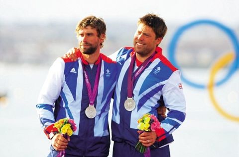 Great Britain's Star class sailing team of Iain Percy (left) and Andrew Simpson after receiving their silver medals today. PRESS ASSOCIATION Photo. Picture date: Sunday August 5, 2012. See PA story OLYMPICS Sailing. Photo credit should read: Chris Ison/PA Wire