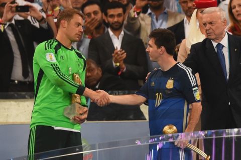 RIO DE JANEIRO, BRAZIL - JULY 13:  Golden Glove winner Manuel Neuer of Germany shakes hands with Golden Ball winner Lionel Messi of Argentina after Germany's 1-0 win in extra time during the 2014 FIFA World Cup Brazil Final match between Germany and Argentina at Maracana on July 13, 2014 in Rio de Janeiro, Brazil.  (Photo by Laurence Griffiths/Getty Images)