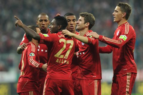 Bayern Munich's Austrian midfielder David Alaba (3rd L) celebrates with teammates after scoring the 2-0 during the German Football League DFB Cup second round match between FC Bayern Munich and FC Ingolstadt in Munich, southern Germany, on October 26, 2011.     AFP PHOTO / CHRISTOF STACHE

RESTRICTIONS / EMBARGO - DFL LIMITS THE USE OF IMAGES ON THE INTERNET TO 15 PICTURES (NO VIDEO-LIKE SEQUENCES) DURING THE MATCH AND PROHIBITS MOBILE (MMS) USE DURING AND FOR FURTHER TWO HOURS AFTER THE MATCH. FOR MORE INFORMATION CONTACT DFL. (Photo credit should read CHRISTOF STACHE/AFP/Getty Images)