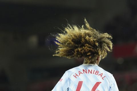 Manchester United's Hannibal Mejbri walks onto the field during the English Premier League soccer match between Liverpool and Manchester United at Anfield stadium in Liverpool, England, Tuesday, April 19, 2022. (AP Photo/Jon Super)