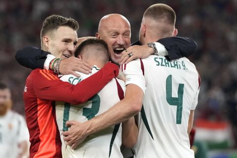 Hungary's coach Marco Rossi celebrates with players at the end of a Group A match between Scotland and Hungary at the Euro 2024 soccer tournament in Stuttgart, Germany, Sunday, June 23, 2024. (AP Photo/Antonio Calanni)