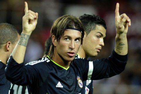 Real Madrid's defender Sergio Ramos celebrates after scoring during the Spanish league football match Sevilla vs Real Madrid on Mayo 7, 2011 at Ramon Sanchez Pizjuan stadium in Sevilla. AFP PHOTO / CRISTINA QUICLER (Photo credit should read CRISTINA QUICLER/AFP/Getty Images)