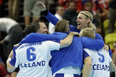 Team Iceland celebrate after defeating Sweden in their men's handball preliminary match at the 2012 Summer Olympics, Thursday, Aug. 2, 2012, in London. (AP Photo/Matthias Schrader)