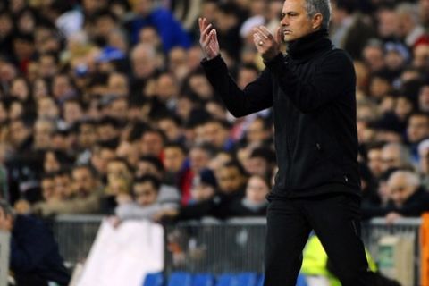 Real Madrid's Portuguese coach Jose Mourinho throws the ball during the Spanish league football match Real Madrid vs Racing Santander on February 18, 2012 at the Santiago Bernabeu stadium in Madrid. AFP PHOTO/ PIERRE-PHILIPPE MARCOU (Photo credit should read PIERRE-PHILIPPE MARCOU/AFP/Getty Images)