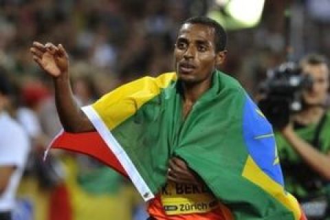 Ethiopian Kenenisa Bekele reacts after winning the men's 5000 meter race ahead of US Dawn Harper, at the Weltklasse Golden League athletics meeting in the Letzigrund stadium in Zurich, Switzerland, Friday, Aug. 28, 2009. (AP Photo/Keystone, Dominique Favre)