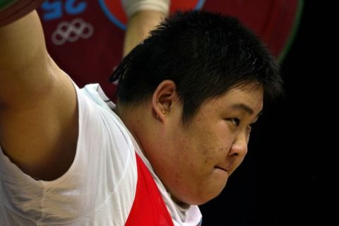 China's Zhou Lulu competes during the women's 75+kg group A weightlifting event of the London 2012 Olympic Games at The Excel Centre in London on August 5, 2012.   AFP PHOTO / YURI CORTEZ        (Photo credit should read YURI CORTEZ/AFP/GettyImages)