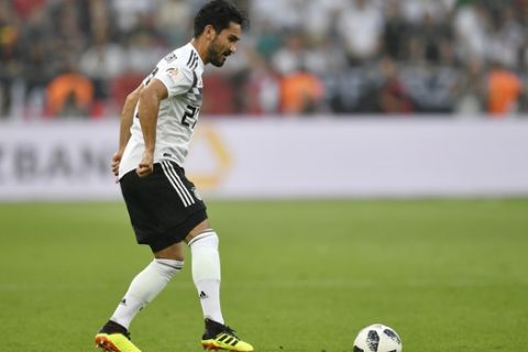 Germany's Ilkay Gundogan plays the ball during a friendly soccer match between Germany and Saudi Arabia at BayArena in Leverkusen, Germany, Friday, June 8, 2018. (AP Photo/Martin Meissner)