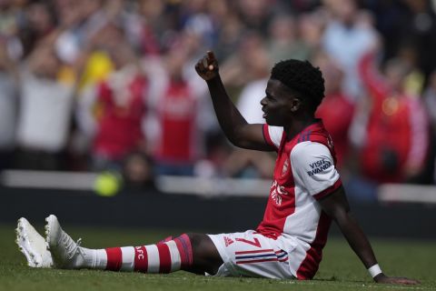 Arsenal's Bukayo Saka signals after getting injured during an English Premier League soccer match between Arsenal and Manchester United at the Emirates stadium in London, Saturday April 23, 2022. (AP Photo/Alastair J. Grant)