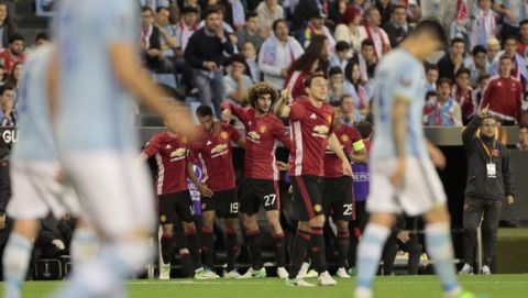 Manchester United players celebrate after Marcus Rashford scored the opening goal during a Europa League, semifinal, first leg soccer match between Celta and Manchester United at the Balaidos stadium in Vigo, Spain, Thursday May 4, 2017. (AP Photo/Lalo R. Villar)