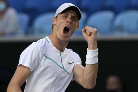 Denis Shapovalov of Canada celebrates a point win over Reilly Opelka of the U.S. during their third round match at the Australian Open tennis championships in Melbourne, Australia, Friday, Jan. 21, 2022. (AP Photo/Simon Baker)