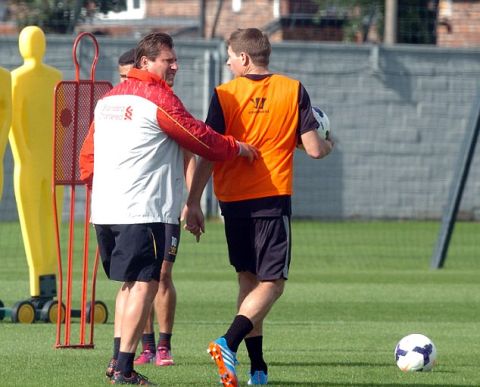  PICTURE BY CHRIS NEILL - 07930-353682 - STEVEN GERRARD HAD TO BE HELD BACK FROM CONFRONTING A CRAZED MEMBER OF THE PUBLIC TODAY DURING TRAINING.....THE INCIDENT TOOK PLACE AS ENGLAND CAPTAIN GERRARD WAS PRACTICING FREE KICKS WITH FELLOW PLAYER PHILPPE COUTINHO...THE UNAMED MALE CLIMBED THE WALL AT THE CLUBS MELWOOD TRAINING GROUND AND BEGAN SHOUTING ABUSE AT THE LIVERPOOL CAPTAIN......AT FIRST HE IGNORED THE ABUSE BUT WHEN IT GOT PERSONAL HE REACTED....THE MALE SHOUTED.....''I KNOW WHERE YOU LIVE YA PRICK....I''LL BURN YOUR FUCKIN HOUSE DOWN''.....LIVERPOOL ASSISTANT MANAGER COLIN PASCOE HELD GERRARD BACK AS HE WENT TO CONFRONT HIM....AT THAT POINT THE CLUB KIT MANAGER LEE RADCLIFFE RAN FROM THE FOOTBALL FIELD AND OUTSIDE THE TRAINING GROUND BUT AS HE DID THE MALE RODE OFF ON HIS BIKE BEFORE SHOUTING.....''I'LL KILL YOU AND YOUR FUCKING KIDS''.....