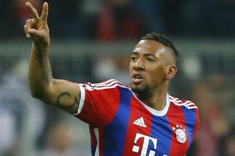 FILE - In this March 11, 2015 file picture Bayern's Jerome Boateng celebrates  after scoringduring the Champions League round of 16 second leg soccer match between Bayern Munich and Shakhtar Donetsk in Munich, southern Germany.  Defender Jerome Boateng struck a blow for his trade in winning Germany's footballer of the year for the 2015-16 season in a poll of sports journalists. The 27-year-old Bayern Munich center-back is the first defender to win the award since Borussia Dortmund's Juergen Kohler in 1997. Boateng collected 163 of 674 votes registered by Kicker magazine.  (AP Photo/Matthias Schrader,file)