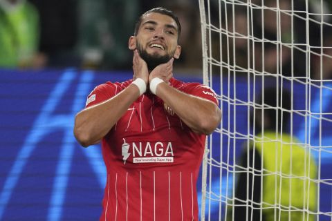 Sevilla's Rafa Mir reacts after missing a chance to score during the Champions League group G soccer match between VfL Wolfsburg and Sevilla in Wolfsburg, Germany, Wednesday, Sept. 29, 2021. (AP Photo/Michael Sohn)