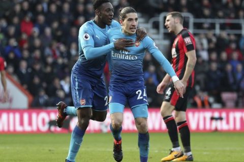 Arsenal's Hector Bellerin celebrates scoring their first goal of the game against Bournemouth, during their English Premier League soccer match at the Vitality Stadium in Bournemouth, England, Sunday Jan. 14, 2018. (David Davies/PA via AP)