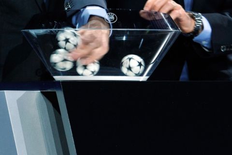 Subject: gettychampions On 2013-08-29, at 5:43 PM, Grant, Rob wrote: MONACO - AUGUST 29: Balls are shuffled during the UEFA Champions League group stage 2013/14 draw on August 29, 2013 in Monaco, Monaco.  Champions League draw.jpg