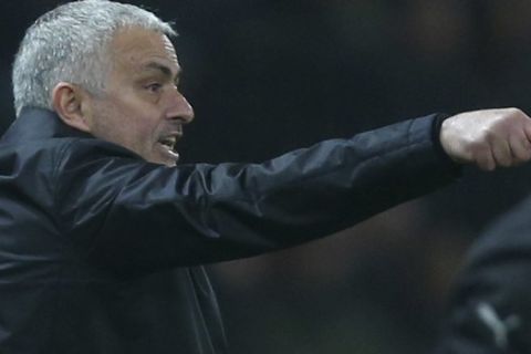 Manchester United's coach Jose Mourinho gives directions to his players during the English Premier League soccer match between Manchester United and Arsenal at Old Trafford stadium in Manchester, England, Wednesday Dec. 5, 2018. (AP Photo/Dave Thompson)