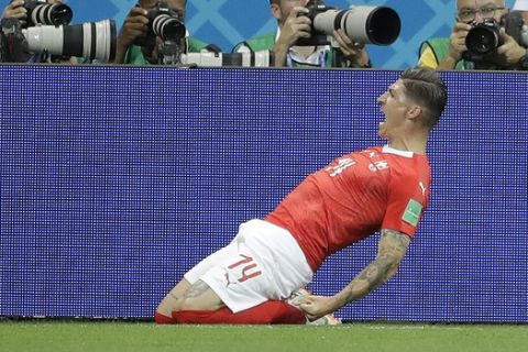 Switzerland's Steven Zuber celebrates after scoring during the group E match between Brazil and Switzerland at the 2018 soccer World Cup in the Rostov Arena in Rostov-on-Don, Russia, Sunday, June 17, 2018. (AP Photo/Felipe Dana)