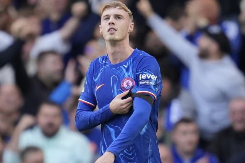 Chelsea's goalie Cole Palmer celebrates after scoring his side's 3rd goal during the British Premier League soccer match between Chelsea and Brighton at Stamford Bridge, Saturday, Sept. 28, 2024, in London. (AP Photo/Kin Cheung)