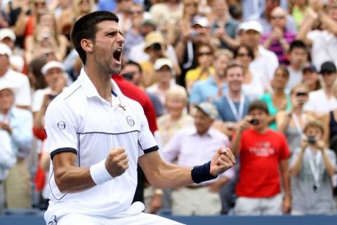 NEW YORK, NY - SEPTEMBER 10:  Novak Djokovic of Serbia reacts after he won his match against Roger Federer of Switzerland during Day Thirteen of the 2011 US Open at the USTA Billie Jean King National Tennis Center on September 10, 2011 in the Flushing neighborhood of the Queens borough of New York City.  (Photo by Matthew Stockman/Getty Images)