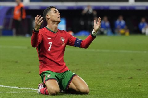 Portugal's Cristiano Ronaldo reacts after missing a chance to score a goal against Slovenia during a round of sixteen match at the Euro 2024 soccer tournament in Frankfurt, Germany, Monday, July 1, 2024. (AP Photo/Antonio Calanni)