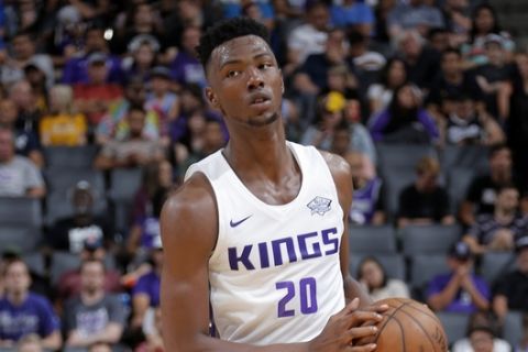 SACRAMENTO, CA - JULY 3: Harry Giles III of the Sacramento Kings handles the ball during the game against the Golden State Warriors on July 3, 2018 at Golden 1 Center in Sacramento, California. NOTE TO USER: User expressly acknowledges and agrees that, by downloading and or using this Photograph, user is consenting to the terms and conditions of the Getty Images License Agreement. Mandatory Copyright Notice: Copyright 2018 NBAE (Photo by Rocky Widner/NBAE via Getty Images)