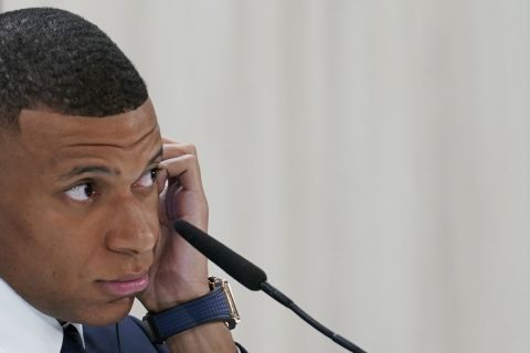 Kylian Mbappe, of France, listens to questions during a news conference after being presented to fans as a new Real Madrid player at the Santiago Bernabeu stadium in Madrid, Tuesday, July 16, 2024. (AP Photo/Andrea Comas)