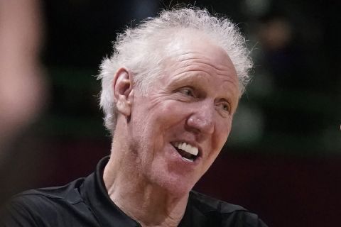 FILE - Basketball Hall of Fame legend Bill Walton laughs during a practice session for the NBA All-Star basketball game in Cleveland, Saturday, Feb. 19, 2022. (AP Photo/Charles Krupa)