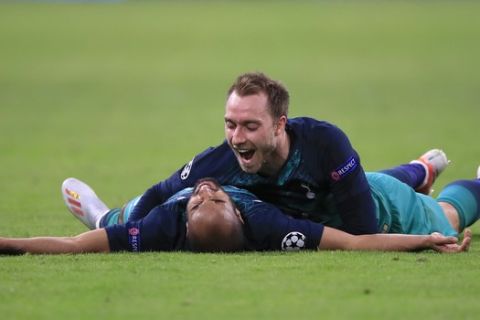 Tottenham's Christian Eriksen celebrates with teammate Lucas Moura, left, at the end of the Champions League semifinal second leg soccer match between Ajax and Tottenham Hotspur at the Johan Cruyff ArenA in Amsterdam, Netherlands, Wednesday, May 8, 2019. (AP Photo/Peter Dejong)