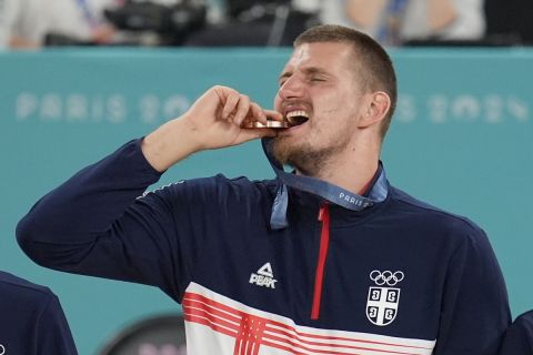 Nikola Jokic (15), of Serbia reacts after his bronze medal after a basketball game at Bercy Arena at the 2024 Summer Olympics, Saturday, Aug. 10, 2024, in Paris, France. (AP Photo/Michael Conroy)