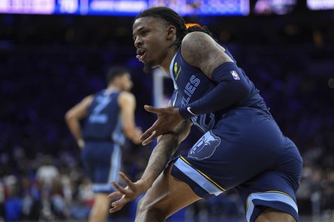 Memphis Grizzlies' Ja Morant reacts after a shot during the second half of an NBA basketball game against the Philadelphia 76ers, Saturday, Nov. 2, 2024, in Philadelphia. (AP Photo/Matt Slocum)