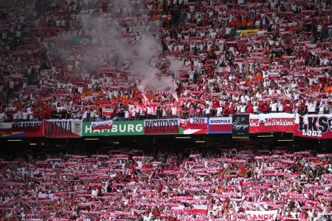 Polish fans burn bengals prior to a Group D match between Poland and the Netherlands at the Euro 2024 soccer tournament in Hamburg, Germany, Sunday, June 16, 2024. (AP Photo/Ebrahim Noroozi)