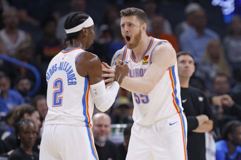 Oklahoma City Thunder center Isaiah Hartenstein, right, and guard Shai Gilgeous-Alexander (2) react to a foul call during the first half of a preseason NBA basketball game, Wednesday, Oct. 9, 2024, in Oklahoma City. (AP Photo/Nate Billings)