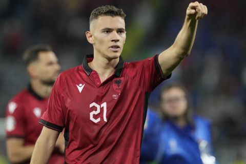 Albania's Kristjan Asllani greets supporters after a Group B match between Italy and Albania at the Euro 2024 soccer tournament in Dortmund, Germany, Saturday, June 15, 2024. Italy won 2-1. (AP Photo/Frank Augstein)