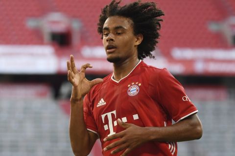 Bayern's Joshua Zirkzee celebrates the opening goal during the German Bundesliga soccer match between Bayern Munich and Borussia Moenchengladbach in Munich, Germany, Saturday, June 13, 2020. Because of the coronavirus outbreak all soccer matches of the German Bundesliga take place without spectators. (Matthias Balk/Pool via AP)