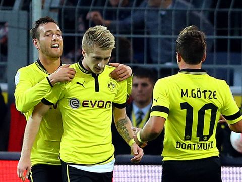 DORTMUND, GERMANY - SEPTEMBER 29: Marco Reus of Dortmund (C) celebrates the first goal with Julian Schieber (L) and Mario Goetze (R) during the Bundesliga match between Borussia Dortmund and VfL Borussia Moenchengladbach at Signal Iduna Park on September 29, 2012 in Dortmund, Germany. (Photo by Christof Koepsel/Bongarts/Getty Images)