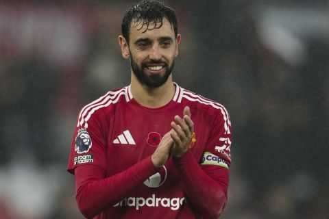 Manchester United's Bruno Fernandes celebrates at the end of the English Premier League soccer match between Manchester United and Leicester City, at the Old Trafford stadium in Manchester, England, Sunday, Nov.10, 2024. (AP Photo/Jon Super)