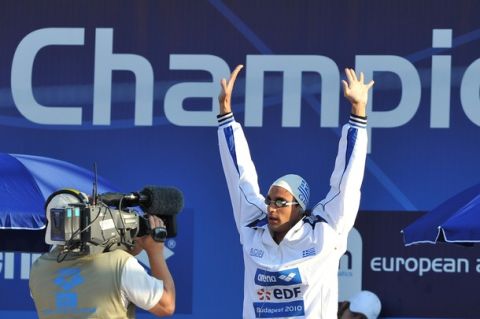 Greece's bronze medalist Ioannis Drymonakos waves before the men's 200m butterfly final at the European Swimming Championships in Budapest on August 12, 2010.  AFP PHOTO / JOE KLAMAR (Photo credit should read JOE KLAMAR/AFP/Getty Images)