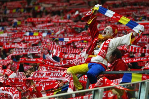 MAINZ, GERMANY - APRIL 20: Supporters of Mainz cheer prior to the Bundesliga match between FSV Mainz 05 and VfL Wolfsburg at Coface Arena on April 20, 2012 in Mainz, Germany.  (Photo by Alex Grimm/Bongarts/Getty Images)