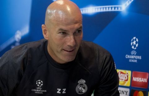 Real Madrid's head coach Zinedine Zidane gets up to leave a press conference during a training session in Madrid,  Tuesday May 9, 2017. Real Madrid will play against Atletico Madrid on Wednesday in a Champions League semifinal, 2nd leg soccer match. (AP Photo/Paul White)