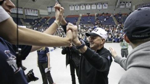 Connecticut coach Jim Calhoun is congratulated by students during a pep rally in Storrs, Conn., Tuesday, April 5, 2011. Connecticut beat Butler 53-41 in the championship game of the NCAA men's college basketball tournament in Houston on Monday. (AP Photo/Charles Krupa)