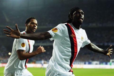 POZNAN, POLAND - NOVEMBER 04:  Emmanuel Adebayor of Manchester City celebrates scoring during the UEFA Europa League Group A match between KKS Lech Poznan and Manchester City at the Bulgarska Street Stadium on November 4, 2010 in Poznan, Poland.  (Photo by Bryn Lennon/Getty Images)