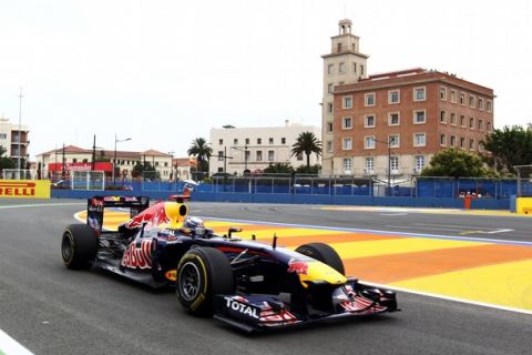 VALENCIA, SPAIN - JUNE 24:  Sebastian Vettel of Germany and Red Bull Racing drives during practice for the European Formula One Grand Prix at the Valencia Street Circuit on July 24, 2011, in Valencia, Spain.  (Photo by Clive Rose/Getty Images)