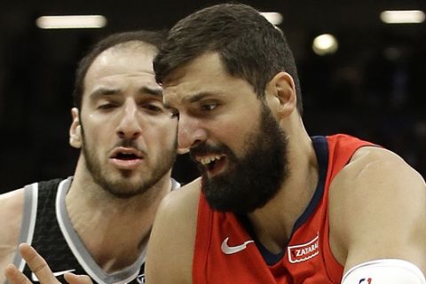 New Orleans Pelicans forward Nikola Mirotic, right, drives against Sacramento Kings center Kosta Koufos during the first quarter of an NBA basketball game Wednesday, March 7, 2018, in Sacramento, Calif. (AP Photo/Rich Pedroncelli)