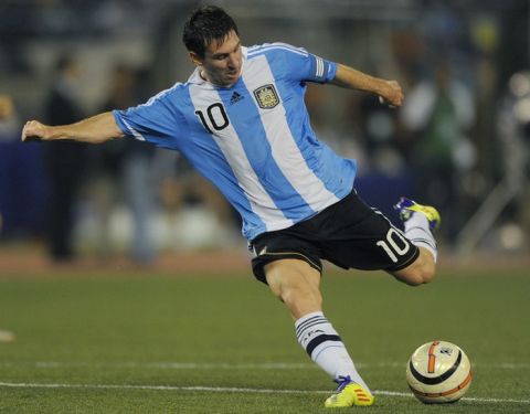 Argentine captain Lionel Messi attempts a shot at the goal during a football match against Venezuela in Kolkata on September 2, 2011. Argentina's football team, lead by the newly elected captain Lionel Messi, beat Venezuela 1-0 in the first ever FIFA Friendly International Match on the Indian subcontinent. AFP PHOTO/ Dibyangshu SARKAR (Photo credit should read DIBYANGSHU SARKAR/AFP/Getty Images)