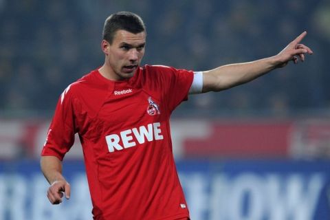 RESTRICTIONS / EMBARGO - ONLINE CLIENTS MAY USE UP TO SIX IMAGES DURING EACH MATCH WITHOUT THE AUTHORISATION OF THE DFL. NO MOBILE USE DURING THE MATCH AND FOR A FURTHER TWO HOURS AFTERWARDS IS PERMITTED WITHOUT THE AUTHORISATION OF THE DFL.Cologne's striker Lukas Podolski gestures during the German first division Bundesliga football match Borussia Dortmund vs 1. FC Cologne in the western German city of Dortmund on March 4, 2011. Dortmund won the match 1-0. AFP PHOTO / PATRIK STOLLARZ (Photo credit should read PATRIK STOLLARZ/AFP/Getty Images)