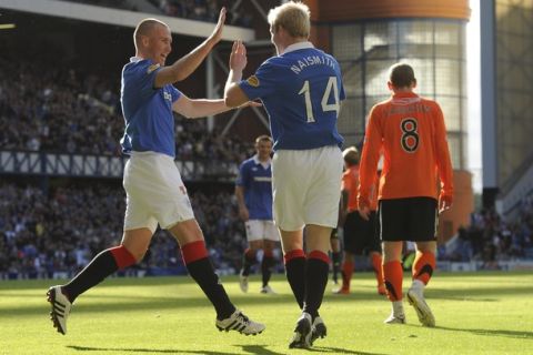 Rangers' Kenny Miller and Steven Naismith celebrates their side's third goal against Dundee Utd during their Scottish Premier League soccer match at Ibrox Stadium, Glasgow, Scotland, September 18, 2010. REUTERS/Russell Cheyne (BRITAIN - Tags: SPORT SOCCER)