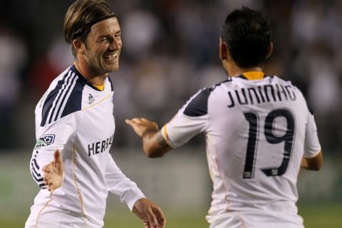 CARSON, CA - MAY 14:   David Beckham #23 and Juninho #19 of the Los Angeles Galaxy celebrate in the game with Sporting Kansas City at The Home Depot Center on May 14, 2011 in Carson, California.  The Galaxy won 4-1.  (Photo by Stephen Dunn/Getty Images)