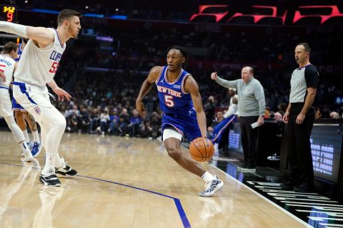 New York Knicks guard Immanuel Quickley (5) dribbles against the Los Angeles Clippers during the first half of an NBA basketball game Sunday, March 6, 2022, in Los Angeles. (AP Photo/Marcio Jose Sanchez)